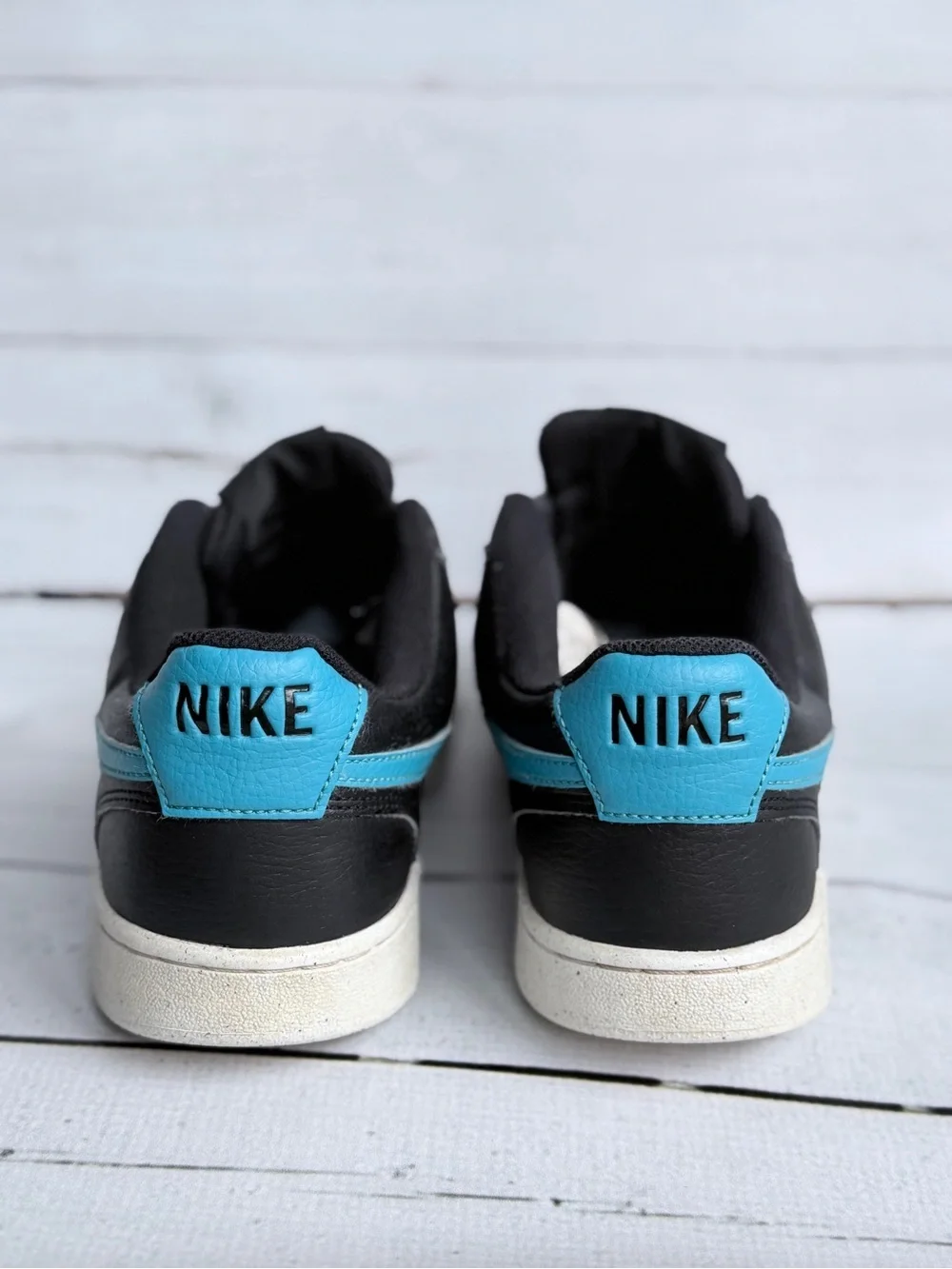 Nike Men’s Black Sneakers with Blue Swoosh